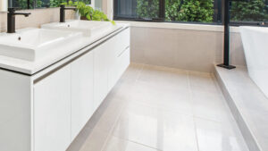 Larger-format wet area tiles in new home bathroom